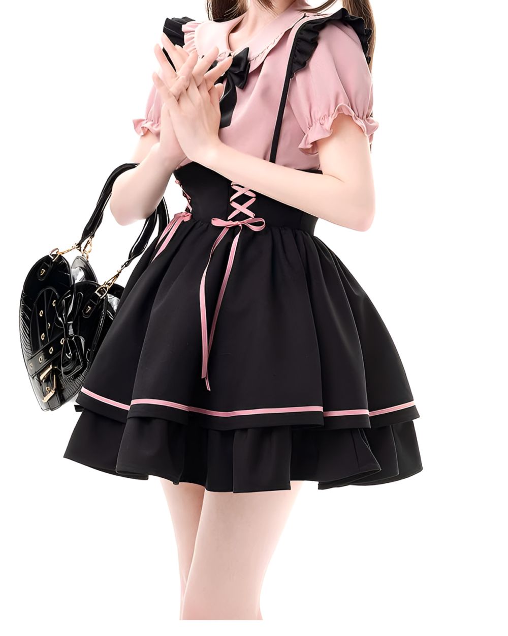 Model wearing a Heartache Lace-Up Pinafore Coord, a Jirai Kei outfit with black and pink color scheme and lace details.