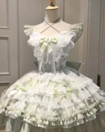 White and light green Hime Lolita Dress with ruffles, lace, and a layered skirt on a mannequin.