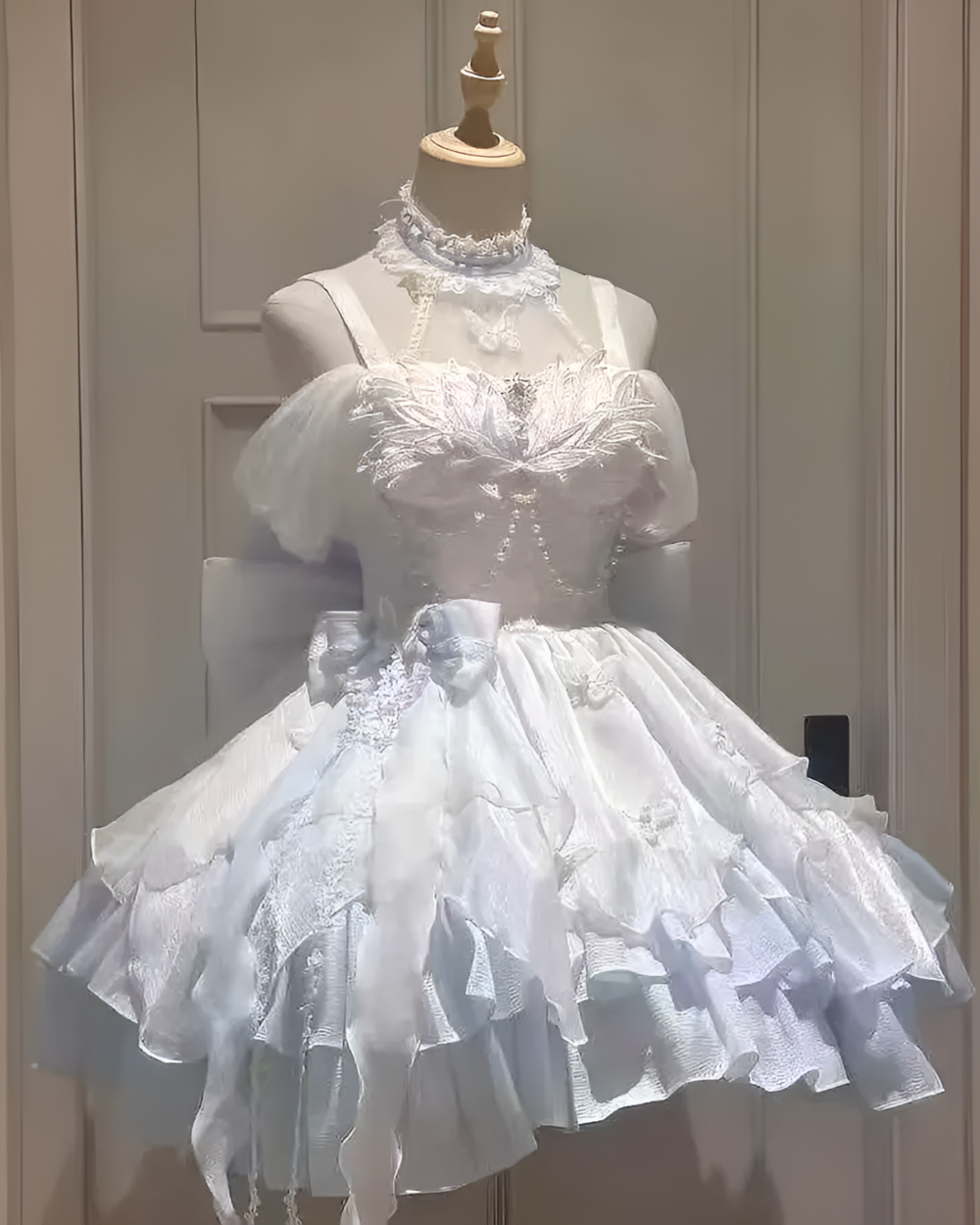 White Hime Lolita Dress on a mannequin, featuring ruffles and lace detailing.
