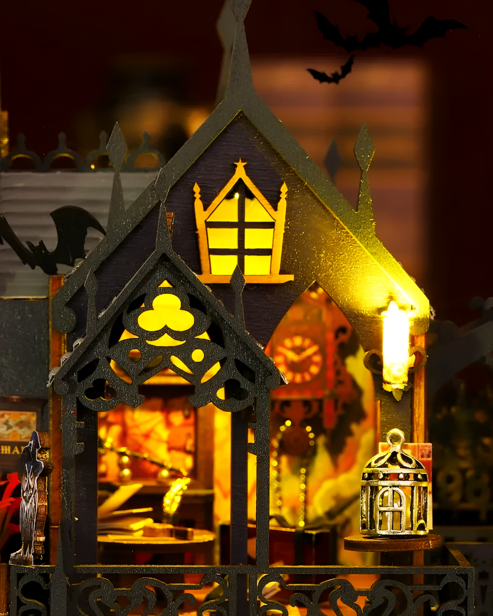 Close-up of a spooky black castle from the Holo Magic City Building Set, illuminated with warm lights.