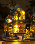 Illuminated Holo Magic City Building Set with detailed shopfronts, an owl, and glowing windows. A miniature city playset.