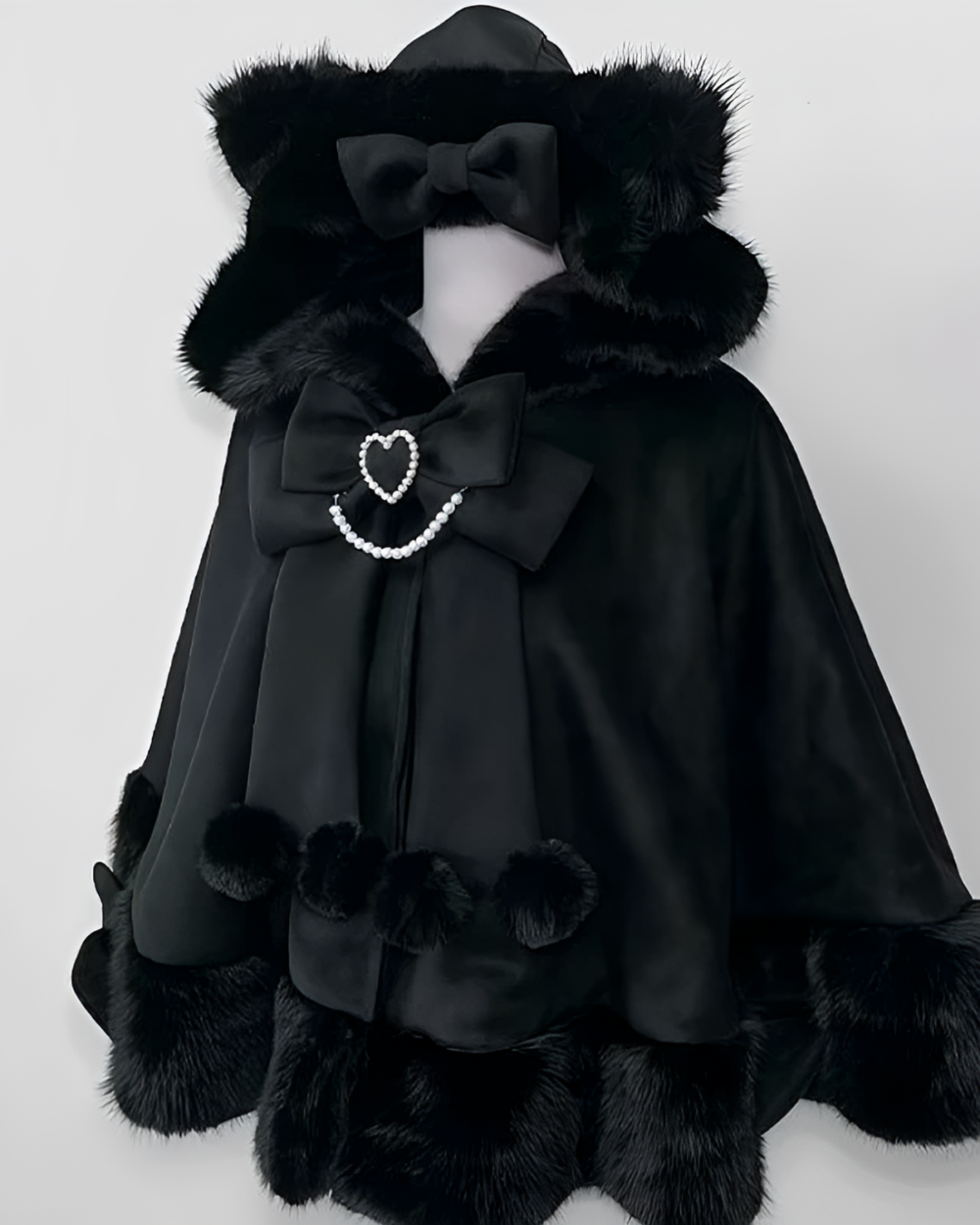 Black hooded Cat Eared Cloak with faux fur trim, bow, and embellishments.