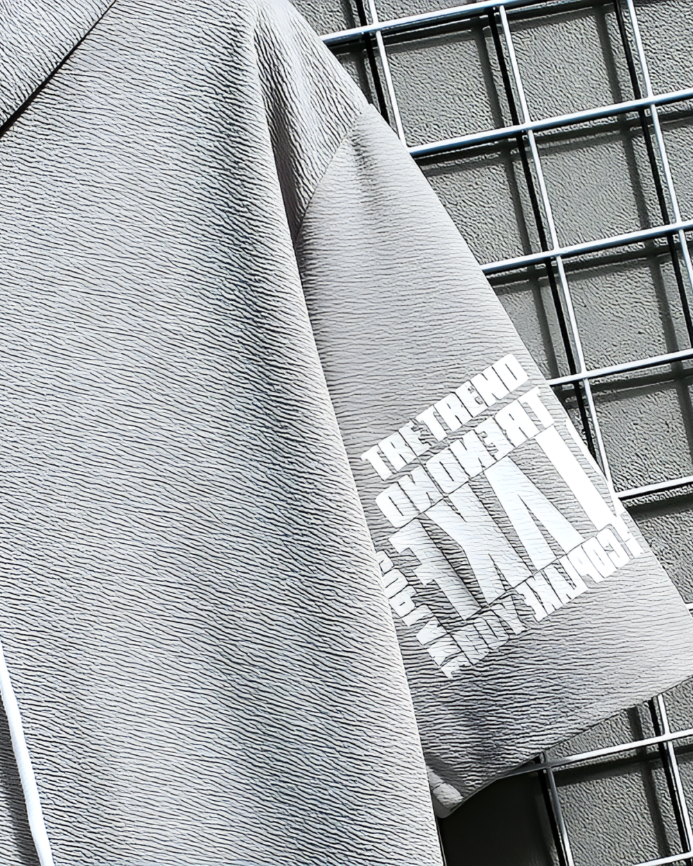 Close-up of a Harajuku aesthetic hoodie, textured fabric detail.