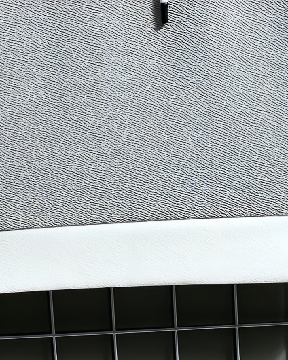 Close-up of a Harajuku aesthetic hoodie fabric texture, gray and white.