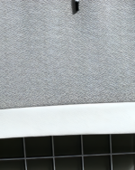 Close-up of a Harajuku aesthetic hoodie fabric texture, gray and white.