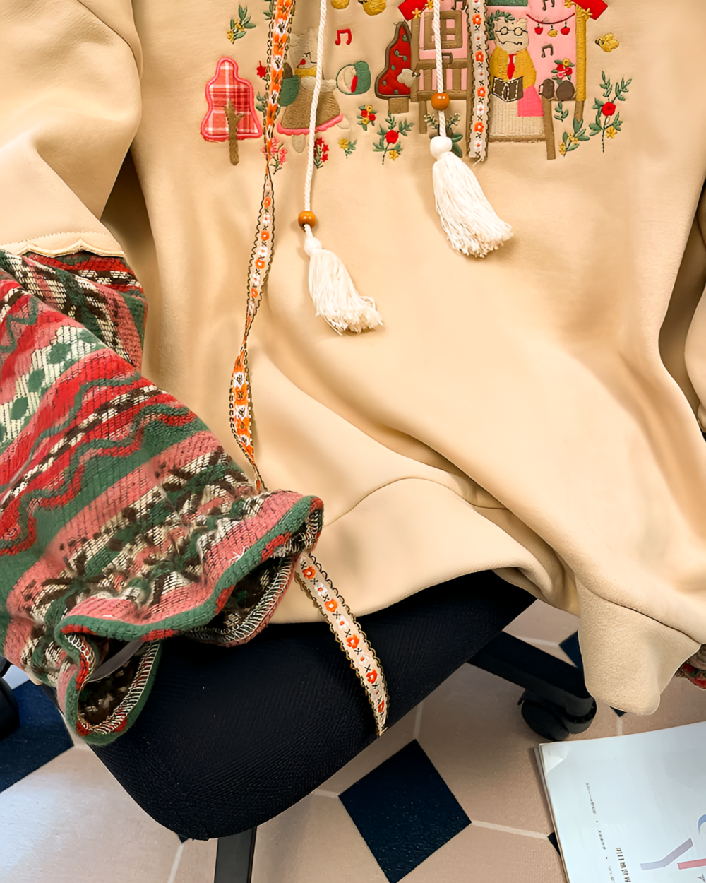 House on the Mountains hoodie featuring an ethno-chic mountain graphic embroidery detail.