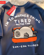 Navy blue T-shirt with a graphic of a tired cat. Features the text "I'm So Mother Fxing Tired All The Time" and "8 AM - 8 PM TIIIRED". A Tired Neko T-Shirt.