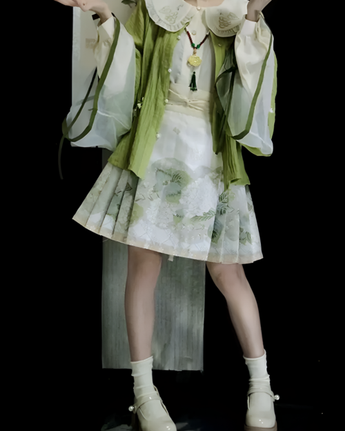 Model wearing the Jade Blossom Neo-Hanfu set, a green and white traditional Chinese outfit. This Neo-Hanfu set features layered details.