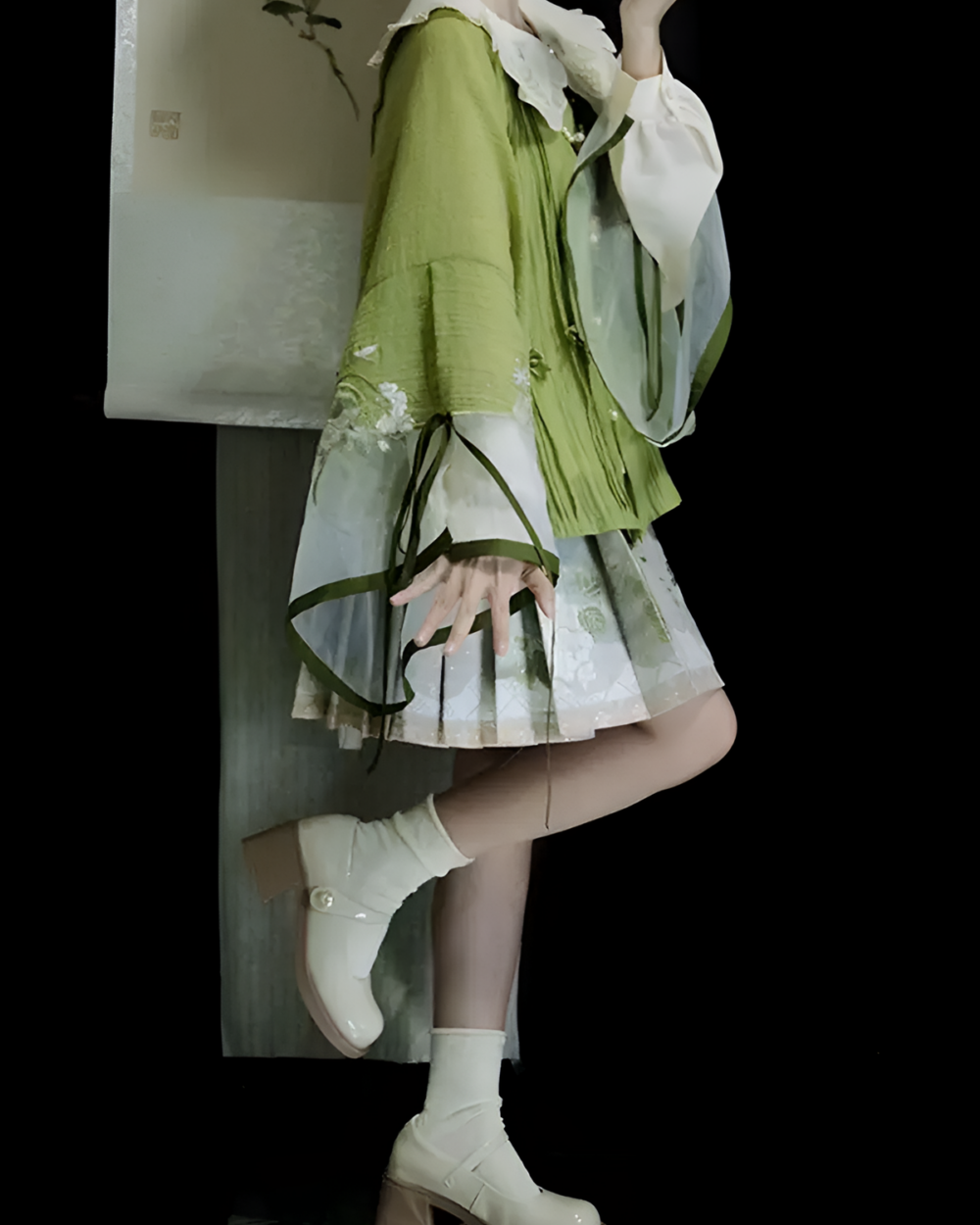 Model wearing the Jade Blossom Neo-Hanfu set; a green and white traditional Chinese-inspired outfit. A full Neo-Hanfu set including top and skirt.