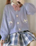 Purple Japanese knitted cardigan with heart and cross details, buttoned closure.