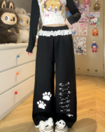 Kaomoji Paw Print Pants featuring adorable paw print details on these black lounge pants.