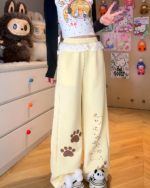 Kaomoji Paw Print Pants featuring paw print design, cutecore style.