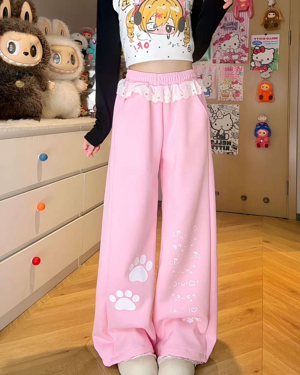 Pink Kaomoji Paw Print Pants, featuring cat paw motifs and a layered design.