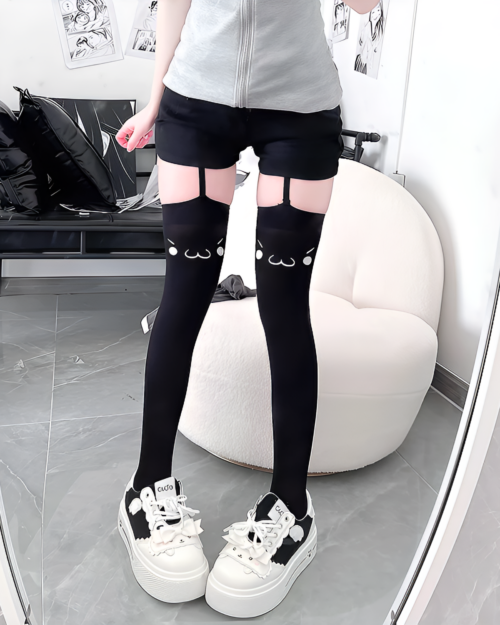 Black Kaomoji Suspender Stockings with cat face details, thigh-high design.