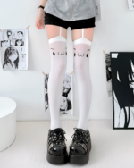White Kaomoji Suspender Stockings with attached straps, visible on a person's legs.