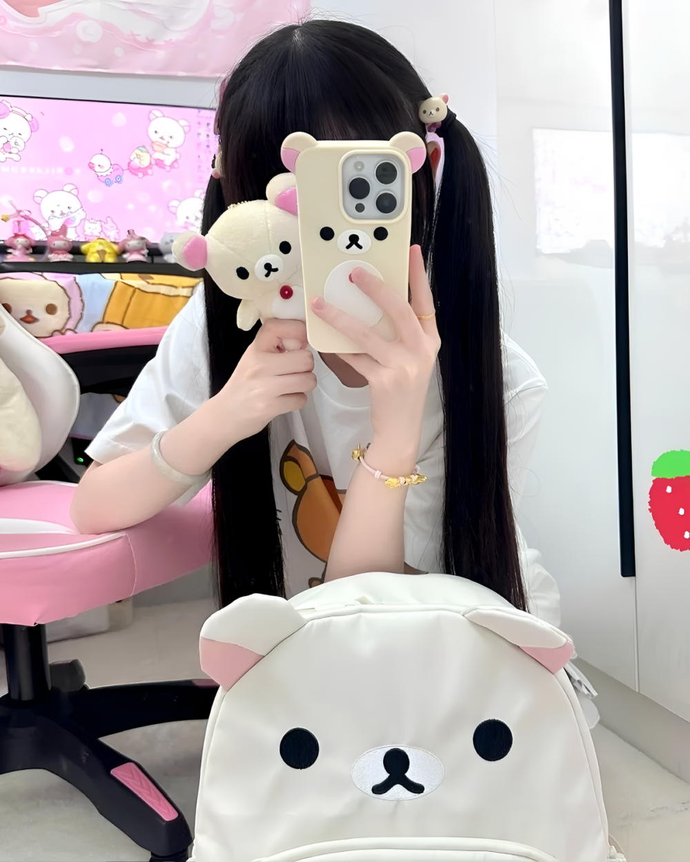 Woman taking a selfie showcasing the white Kawaii Bear Backpack by Jojifuku, featuring a bear face design.