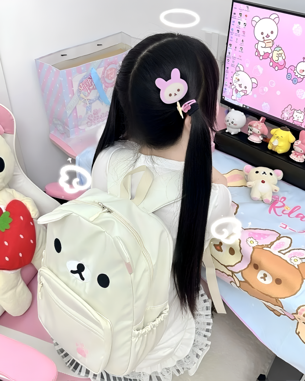 Person wearing a white Kawaii Bear Backpack - Jojifuku. The backpack features a bear face design. Displayed with other plush toys.