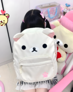 A person wearing a white Kawaii Bear Backpack by Jojifuku. The backpack features a bear face design with paw prints.