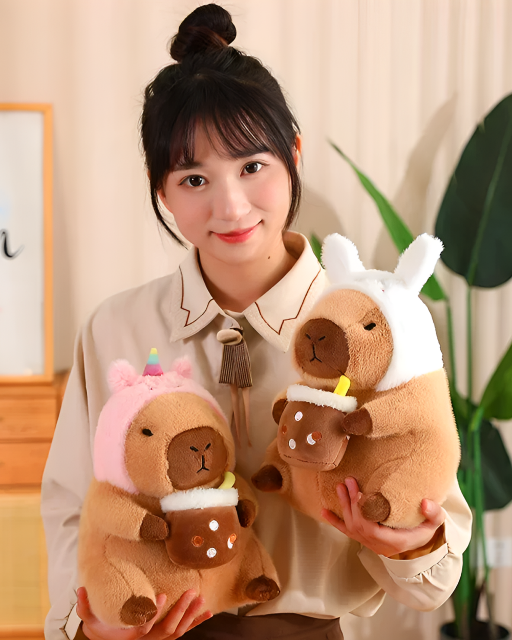 A woman holding Kawaii Capybara Plushies - Bread & Flower Edition. Cute capybara plushie toys in pink and brown colors.