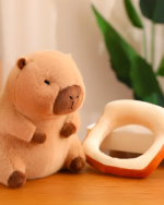 Close-up of a Kawaii Capybara Plushie with a bread slice. Soft, brown capybara plushie toy, part of the Bread & Flower Edition.