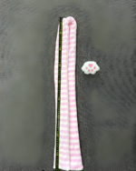 Pink and white Kawaii Neko Paw Scarf with a cat paw print design, laid flat on a grey surface.