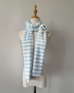 Blue and white striped Kawaii Neko Paw Scarf displayed on a mannequin. Features a fluffy cat paw detail.