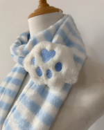 Blue and white striped Kawaii Neko Paw Scarf with a fluffy paw detail on a mannequin. Soft, cozy winter accessory.