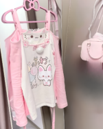 Pink Kawaii Fuwa Fuwa Bunny T-Shirt on hanger with accessories.