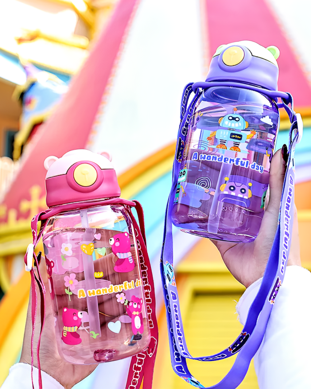 Transparent cute water bottle with a bear design and carrying strap.