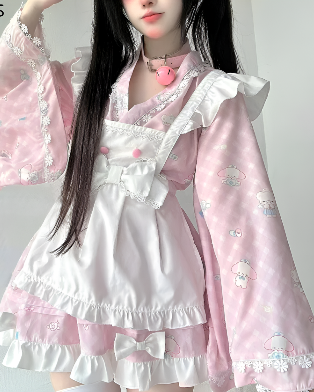 Kawaii lolita style dress featuring a pink and white ruffled design with cute animal motifs.