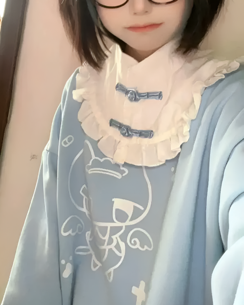 Close-up of a person wearing a kawaii long sleeve t-shirt with a princess design.