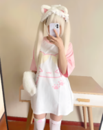 Model wearing a Kawaii Neko T-Shirt featuring a cat face and paw prints.