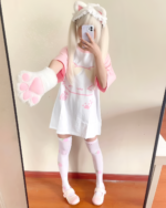 Model wearing a Kawaii Neko T-Shirt with cat paws and socks, Yume Kawaii aesthetic.