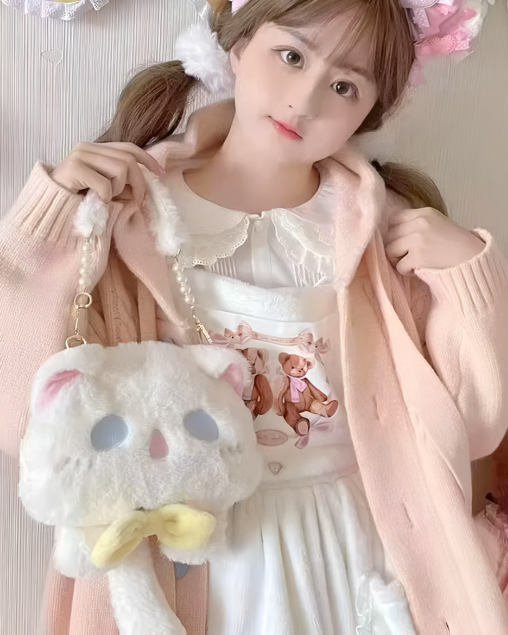 A woman holding a Kawaii Phantom Neko Bag. The bag features a cat design with bear illustrations.