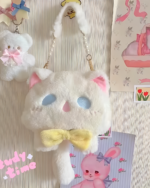 Close-up of the Kawaii Phantom Neko Bag, a white plush cat-shaped purse with pearl strap and yellow bow.