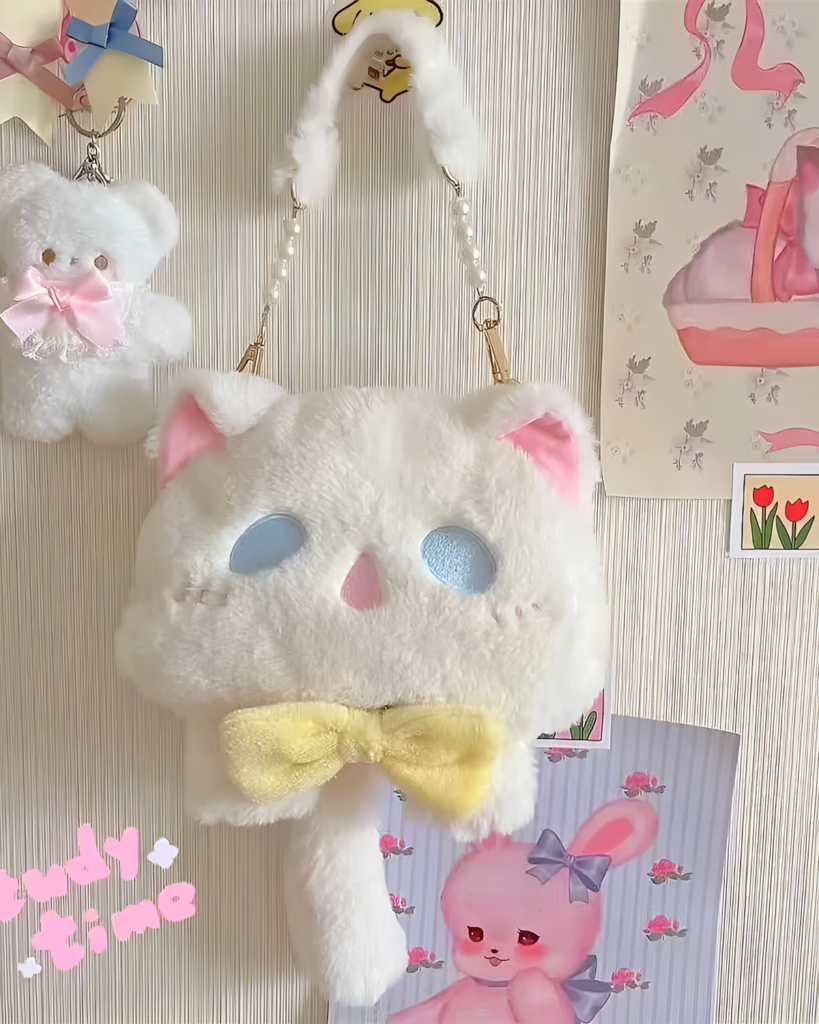 Close-up of the Kawaii Phantom Neko Bag, a white plush cat-shaped purse with pearl strap and yellow bow.