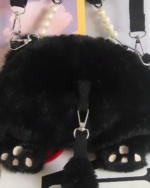 Close-up of the Kawaii Phantom Neko Bag, a black fluffy cat-shaped shoulder bag with pearl and paw details.