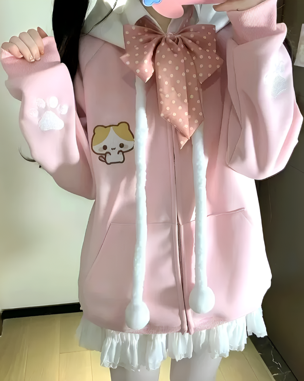 Pink Kawaii Pink Neko Hoodie featuring cat paws and a bow, close-up view.