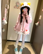 Pink Kawaii Neko Hoodie worn by a person indoors.