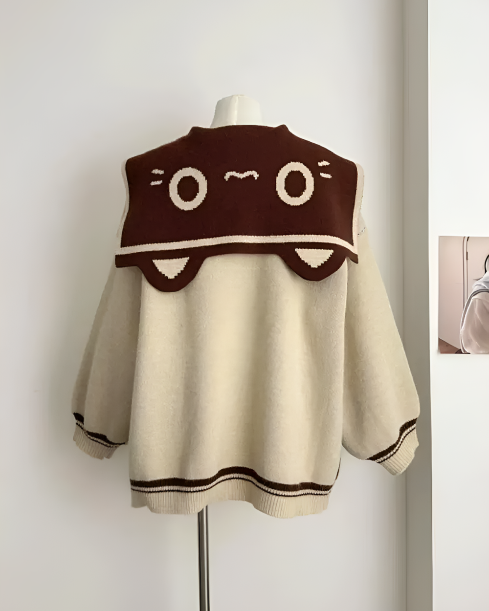 Brown Kawaii Sailor Pullover Sweater back detail with cartoon eyes and a car-shaped collar.