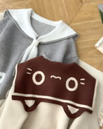 Close-up of a Kawaii Sailor Pullover Sweater featuring a whimsical cartoon character design.