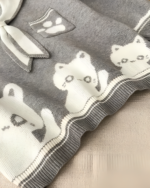 Close-up of a Kawaii Sailor Pullover Sweater featuring white and gray bear illustrations.