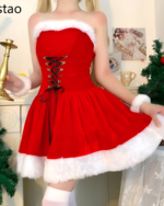 Woman wearing a red Kawaii Shawl Winter Dress with white faux fur trim. A festive Christmas outfit.