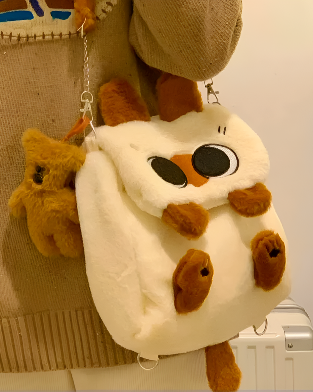 Close-up of a Kawaii Siamese Cat Plush Backpack with a cute face and soft fur.