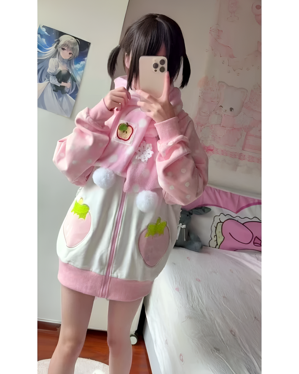Pink strawberry bunny hoodie worn by a person, featuring plush details and a zipper closure.
