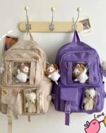 Kawaii Vinyl Pockets Backpack in purple, featuring plush toy decorations.