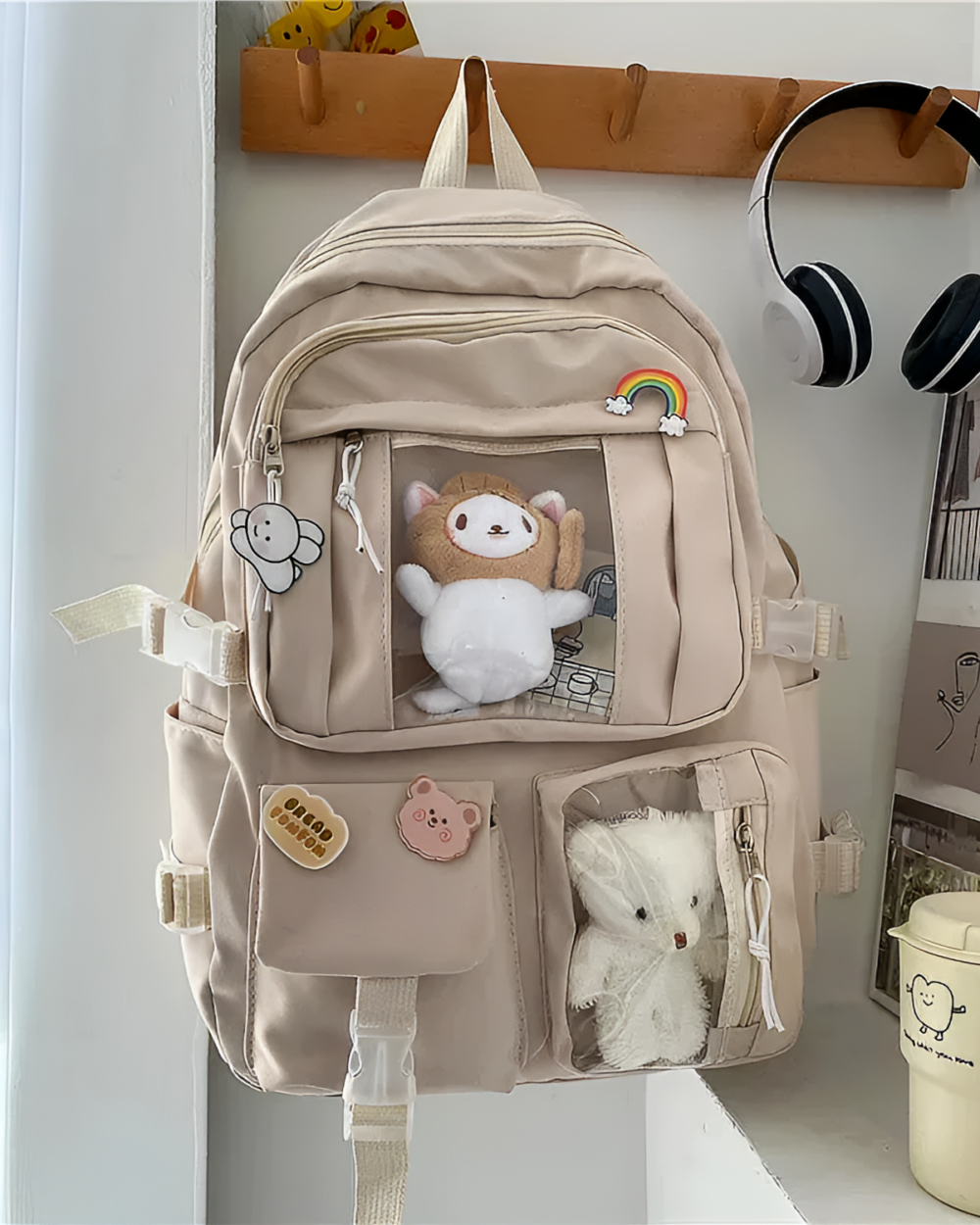 Kawaii Vinyl Pockets Backpack featuring a clear vinyl pocket with plush toys and decorative elements.