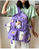 Kawaii vinyl backpack featuring clear vinyl pockets and plush toys.