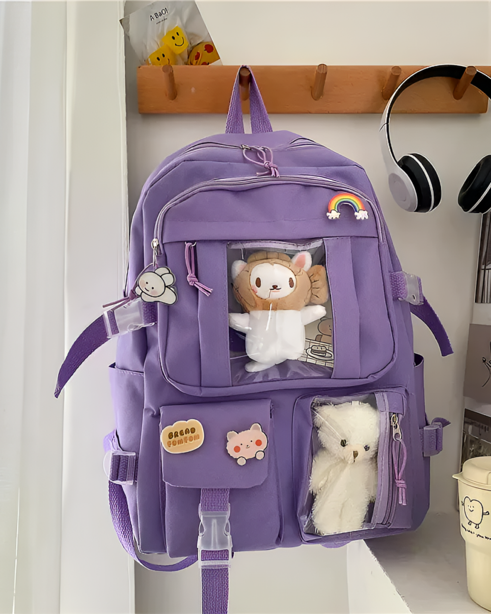 Kawaii Vinyl Pockets Backpack featuring clear vinyl compartments and cute plush decorations.