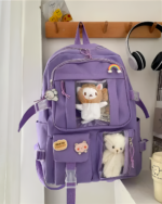 Kawaii Vinyl Pockets Backpack featuring clear vinyl compartments and cute plush decorations.
